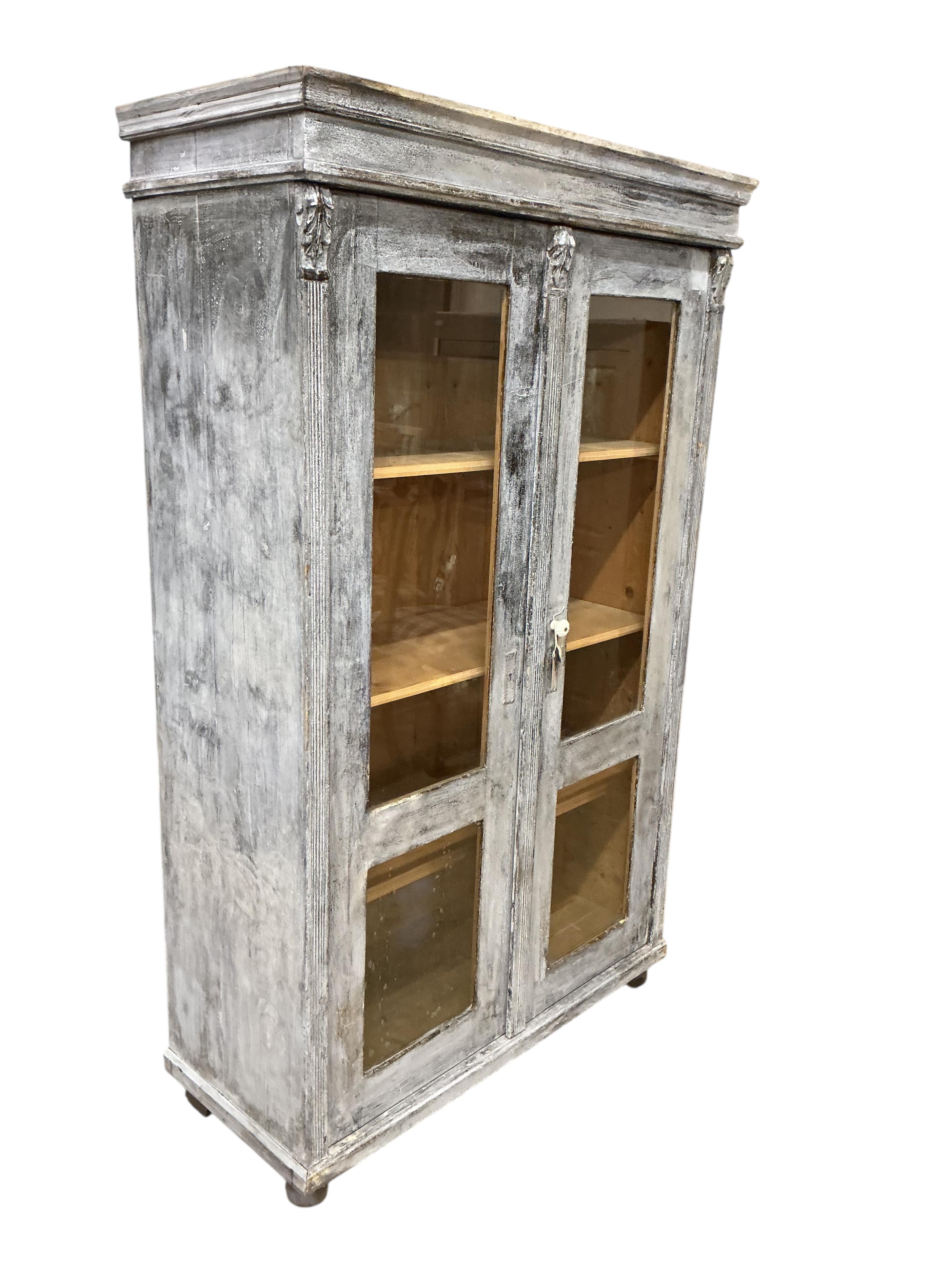 A 19th century East European painted pine cabinet, width 108cm, depth 46cm, height 178cm